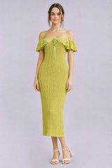 woman wearing a light green off-shoulder ribbed midi dress with ruffle details and a tie at the neckline