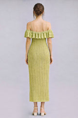 woman wearing a light green off-the-shoulder ribbed midi dress with ruffled hem and fitted silhouette