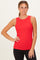 woman wearing a red sleeveless ribbed tank top and black leggings