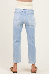 woman wearing light wash maternity jeans with a stretchy waistband, showing the back view