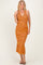 woman wearing a sleeveless orange and black striped maxi dress with a fitted silhouette and a flared hem