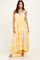 woman wearing a yellow tiered maxi dress with lace trim and adjustable straps