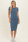 woman wearing a blue ribbed midi dress with short sleeves and a fitted silhouette