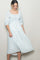 woman wearing a light blue floral midi dress with puff sleeves and a smocked bodice