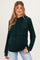 woman wearing a dark green maternity hoodie with a cropped design and a visible baby bump