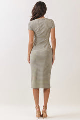 woman wearing a fitted striped midi dress with short sleeves and a scoop back