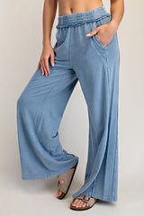 woman wearing light blue wide-leg pants with an elastic waistband and pockets