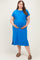 woman wearing a bright blue short sleeve maternity dress with a pocket, gently cradling her baby bump