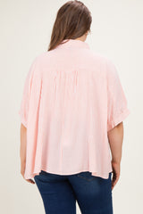 pink and white striped maternity plus top with short sleeves and a loose fit, shown from the back