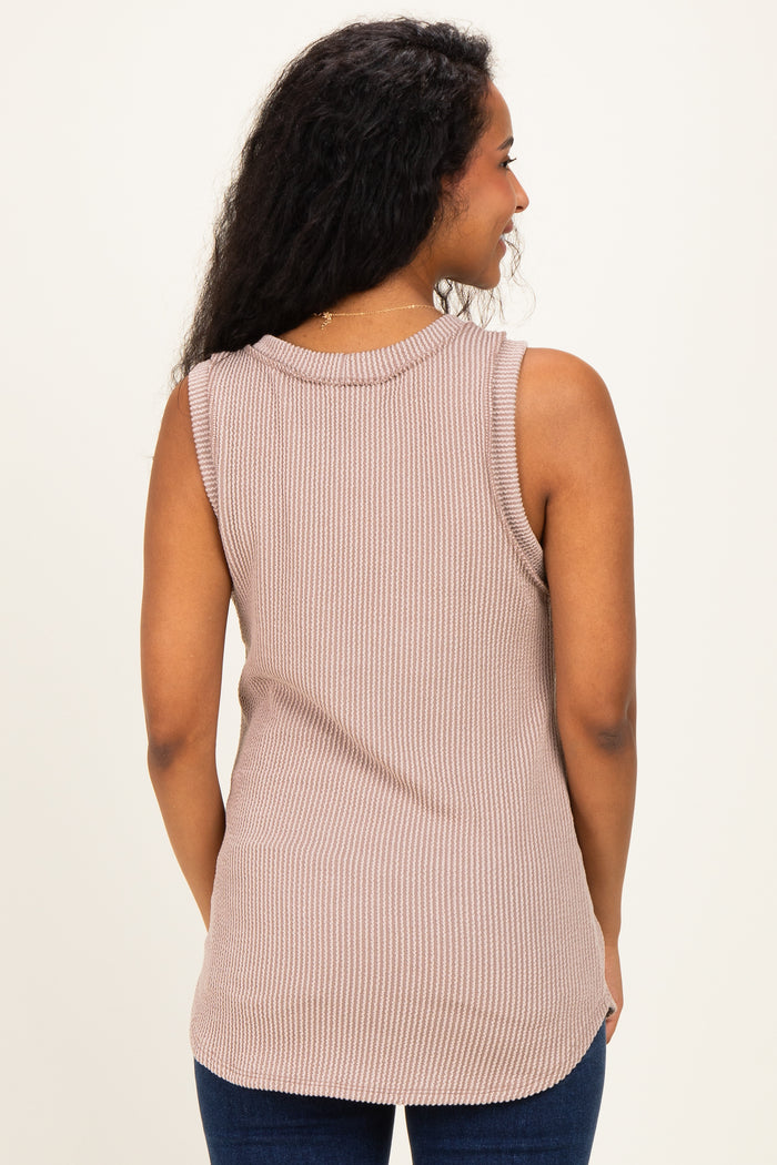 woman wearing a relaxed fit beige ribbed sleeveless maternity top, seen from the back
