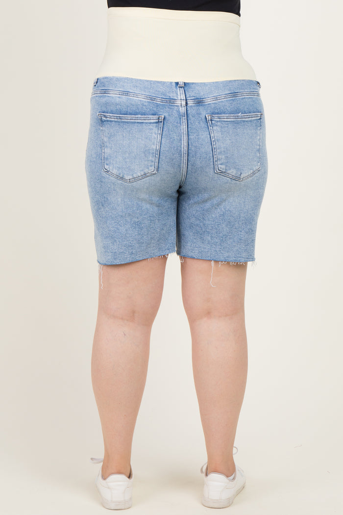 woman wearing maternity plus light blue denim shorts with a supportive waistband, viewed from the back