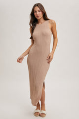 woman wearing a ribbed beige slip dress with a side slit and spaghetti straps