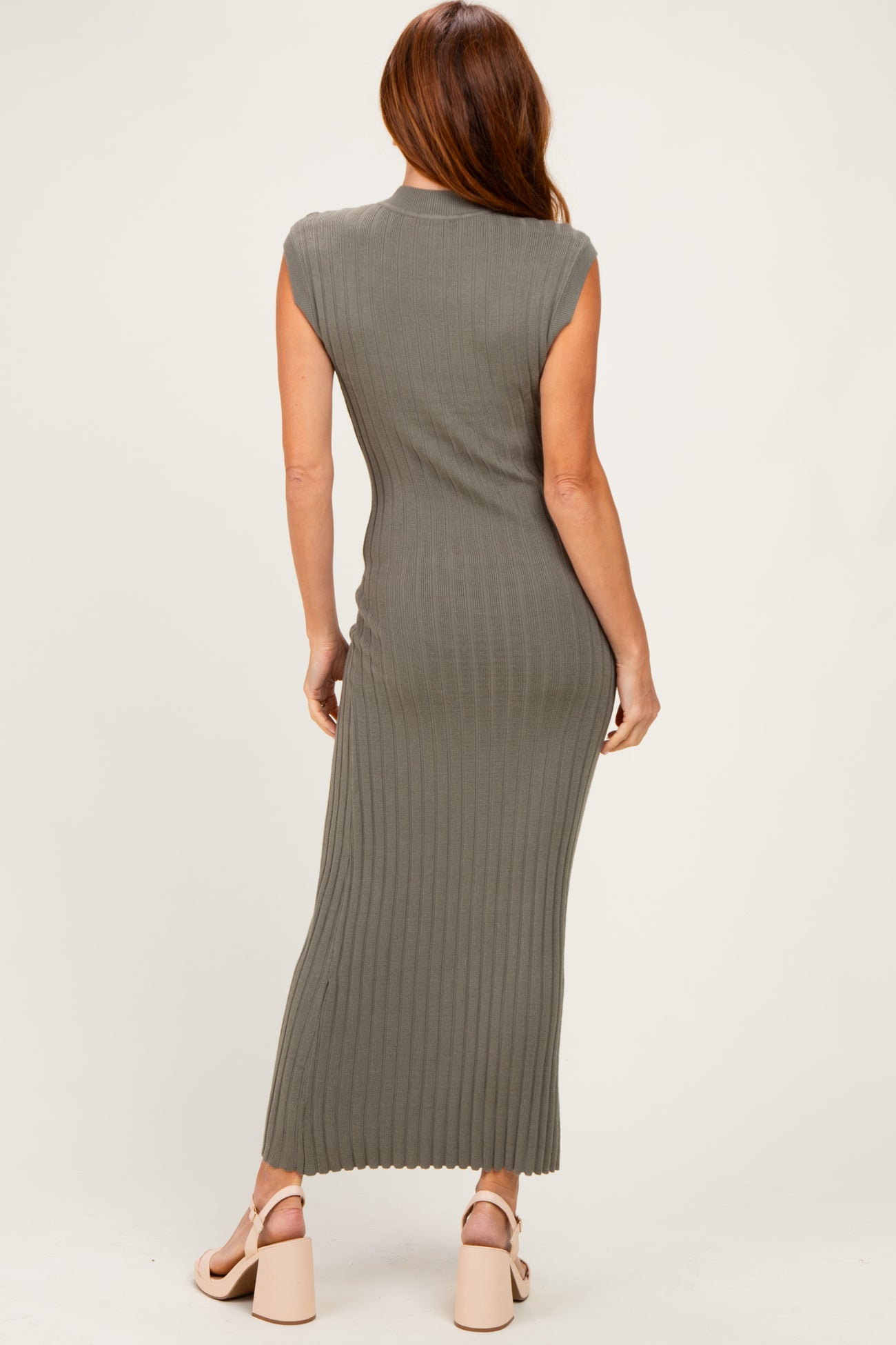 woman wearing a fitted olive green ribbed maxi dress with cap sleeves, shown from the back