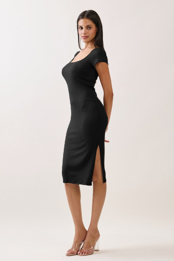 woman wearing a black bodycon dress with short sleeves and side slits