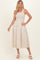 woman wearing a cream and beige striped midi dress with smocked bodice and square neckline