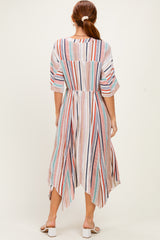 woman wearing a lightweight striped midi dress with a high-low hem and elbow-length sleeves, viewed from the back