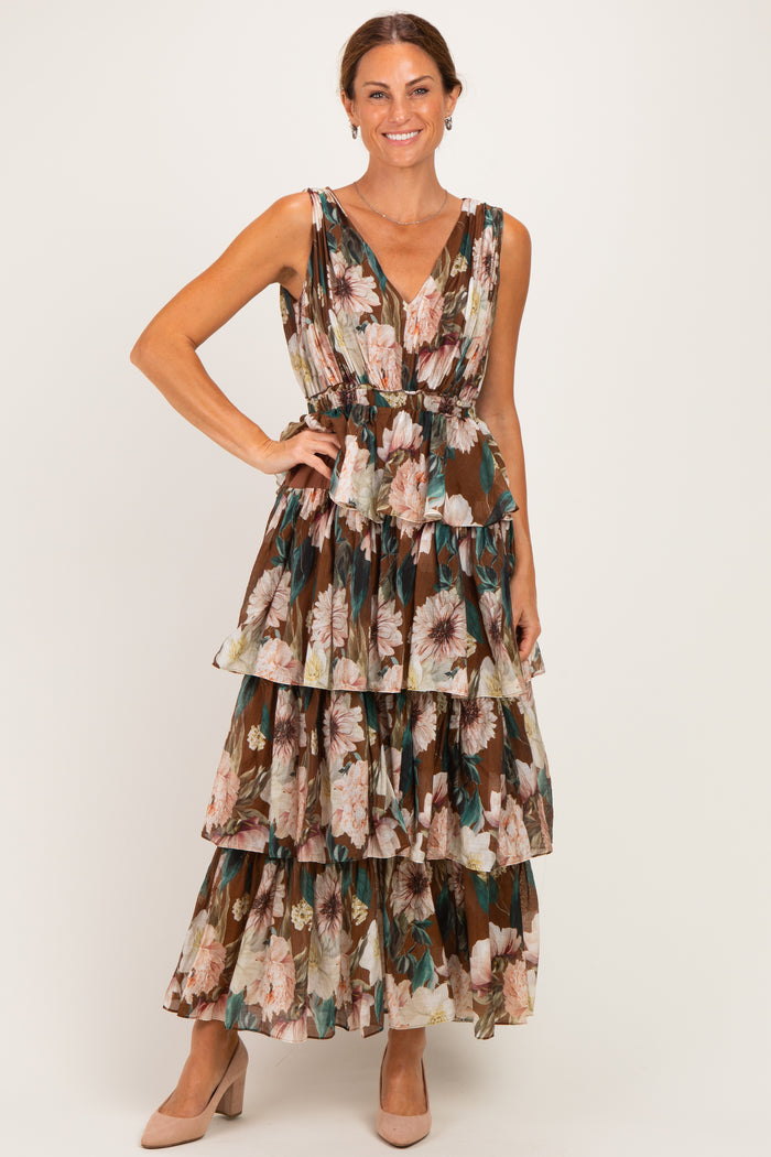 woman wearing a brown floral maxi dress with tiered ruffles and a v-neckline, styled with beige heels