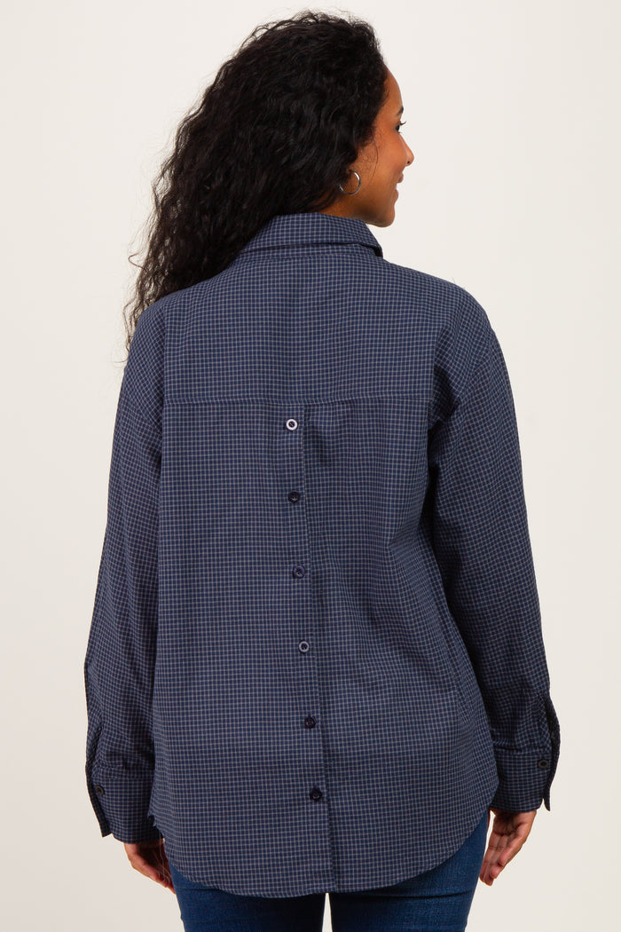 woman wearing a navy blue checked maternity shirt with a button-up back and long sleeves