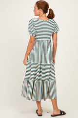 woman wearing a striped tiered maxi dress with short sleeves and a cinched waist, viewed from the back