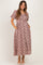 woman wearing a mauve floral print maternity maxi dress with short sleeves and pockets