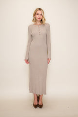 woman wearing a beige ribbed long sleeve maxi dress with button details and high heels