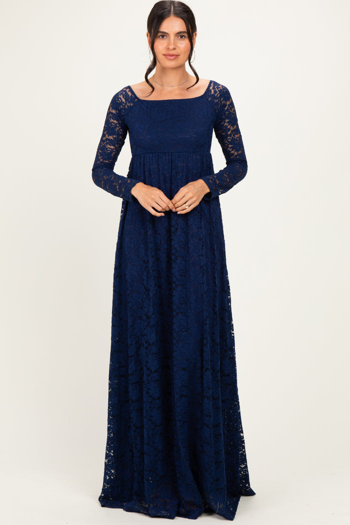 woman wearing a long sleeve navy blue lace maxi dress with a square neckline and fitted bodice