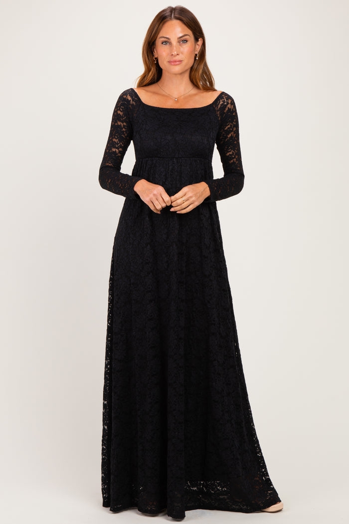 woman wearing a long sleeve black lace maxi dress with a square neckline and fitted waist