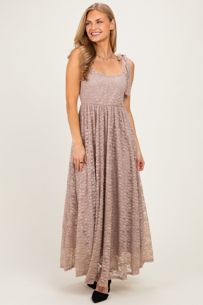 woman wearing a dusty mauve maxi dress with lace details and adjustable shoulder straps