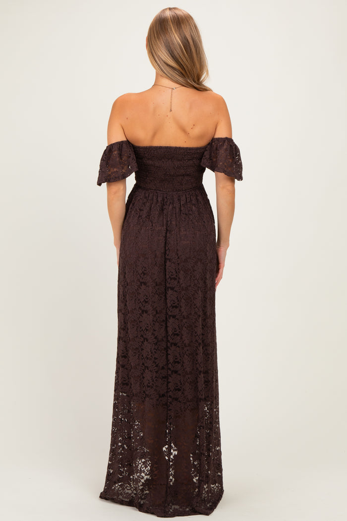 woman wearing a dark brown off-the-shoulder maxi dress with lace details and short puff sleeves, shown from the back