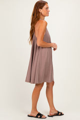 woman wearing a taupe ribbed sundress with a loose fit and thin straps