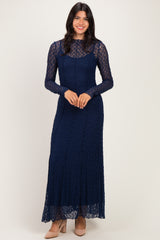 woman wearing a navy blue long sleeve lace gown with a fitted silhouette and round neckline