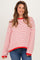 woman wearing a red and white striped oversized maternity sweater with long sleeves