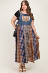 woman wearing a maternity plus plaid maxi dress with denim bib and lace trim, holding a handbag