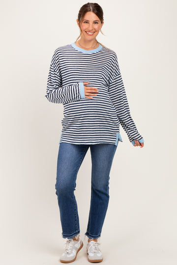 woman wearing a navy and white striped maternity top with long sleeves and a baby bump, paired with blue jeans