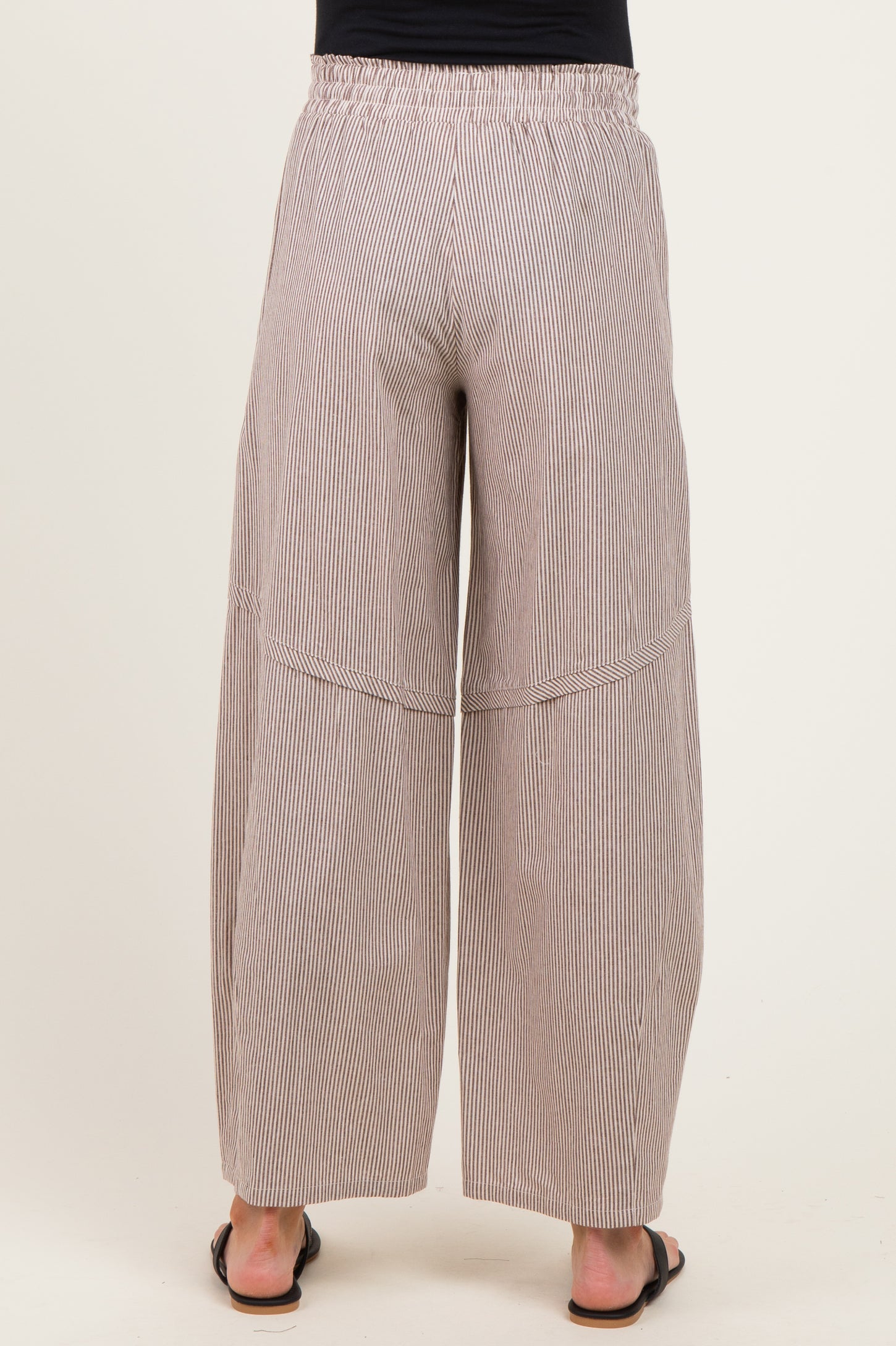 woman wearing striped maternity wide-leg pants with an elastic waistband, seen from the back