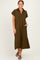 woman wearing an olive green short sleeve maxi dress with a collar and side pockets