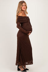 woman wearing a brown lace off-the-shoulder maternity dress, showcasing her baby bump
