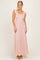 woman wearing a blush pink maxi dress with ruffle detail on the sleeves and lace texture
