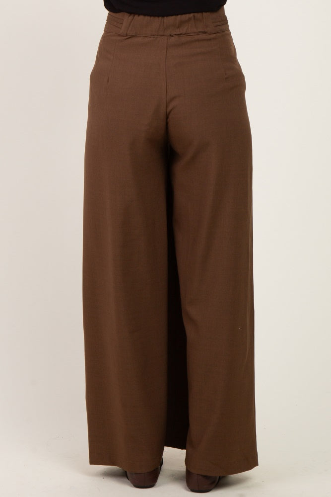 maternity wear wide-leg brown trousers with an elastic waistband, model shown from the waist down