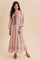woman wearing a pink floral long sleeve maxi dress with a square neckline and bow detail