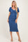 woman wearing a blue puff sleeve midi dress with a fitted silhouette and ruching details