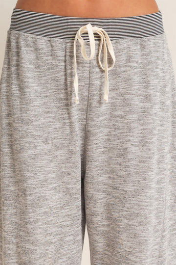 gray lounge pants with a drawstring waist and striped elastic band