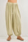 woman wearing light green high-waisted harem pants with a drawstring waist and gathered ankles