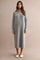woman wearing a gray knit midi dress with a half-zip collar and long sleeves