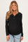 woman wearing a black maternity hoodie with button details and a visible baby bump, paired with light blue jeans