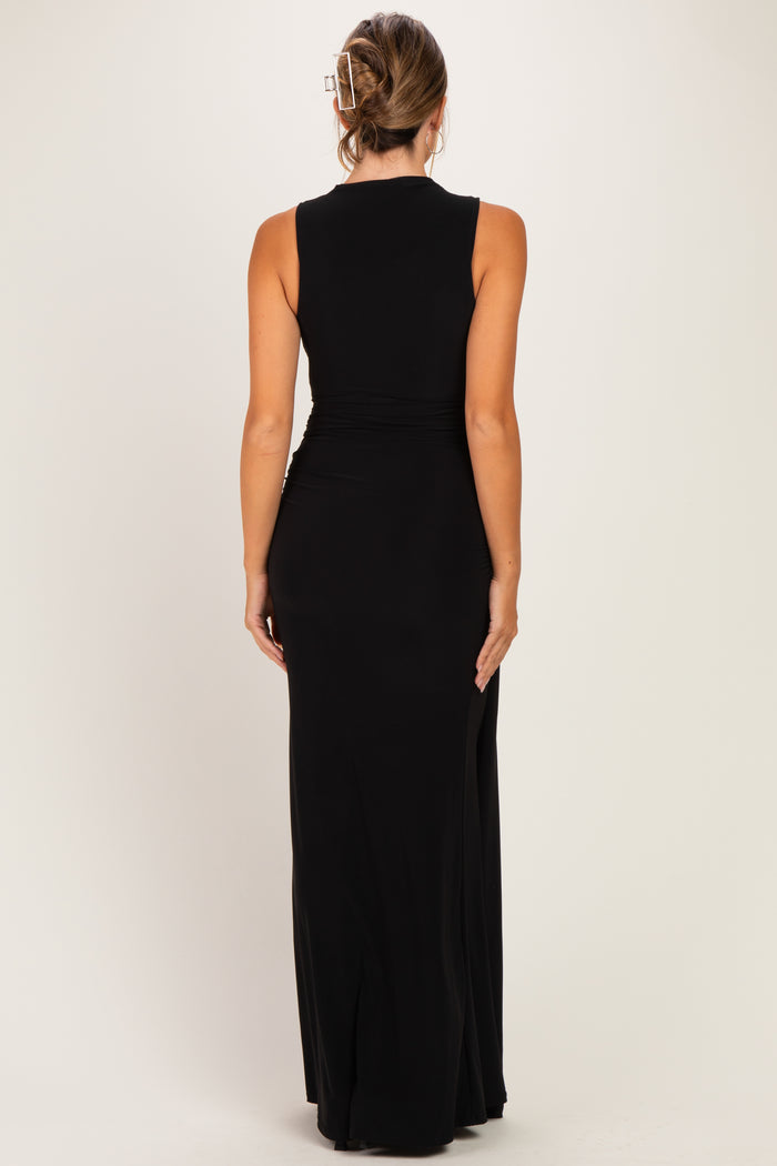 woman wearing a black sleeveless maternity maxi dress, shown from the back