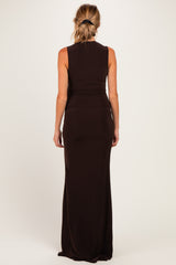 woman wearing a fitted black sleeveless maternity maxi dress, showing smooth back design