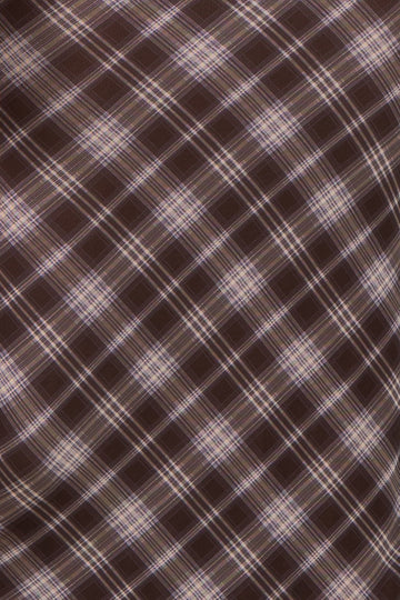 brown plaid fabric with diagonal lines and light purple accents
