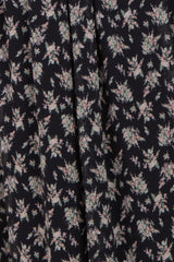 maternity wear in navy blue with a floral print pattern and pleated design