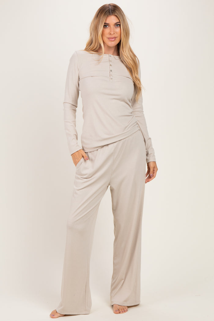 woman wearing a light gray long sleeve button-up top and matching wide-leg pants in a ribbed fabric